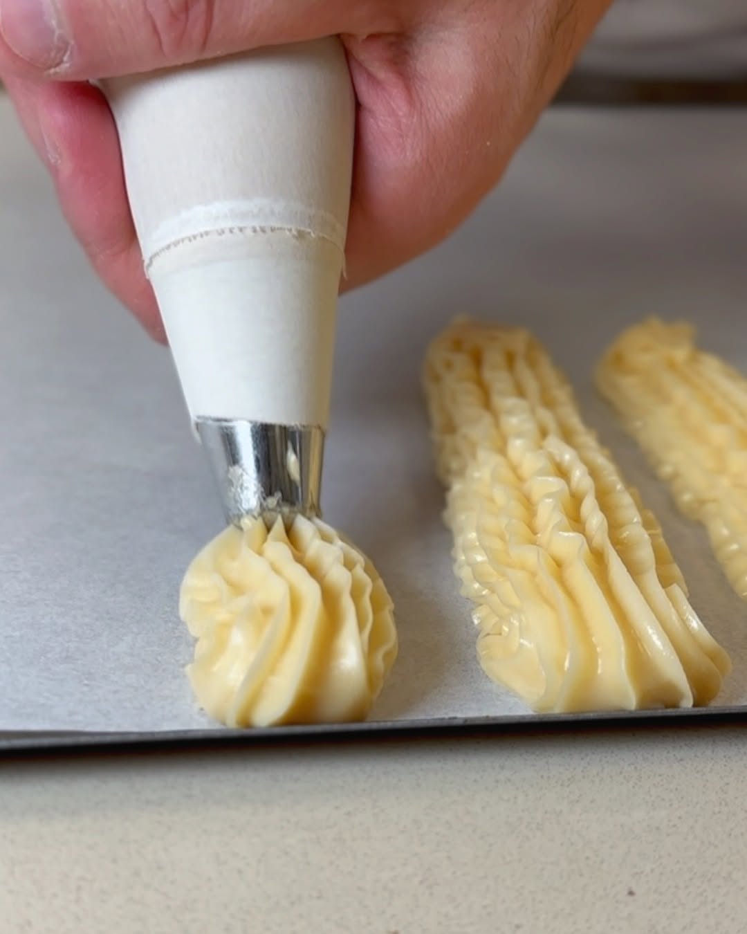 Éclair French Pastry piping choux pastry in class